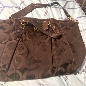 The image shows a Coach Brooke Op Art satchel handbag in brown monogr
